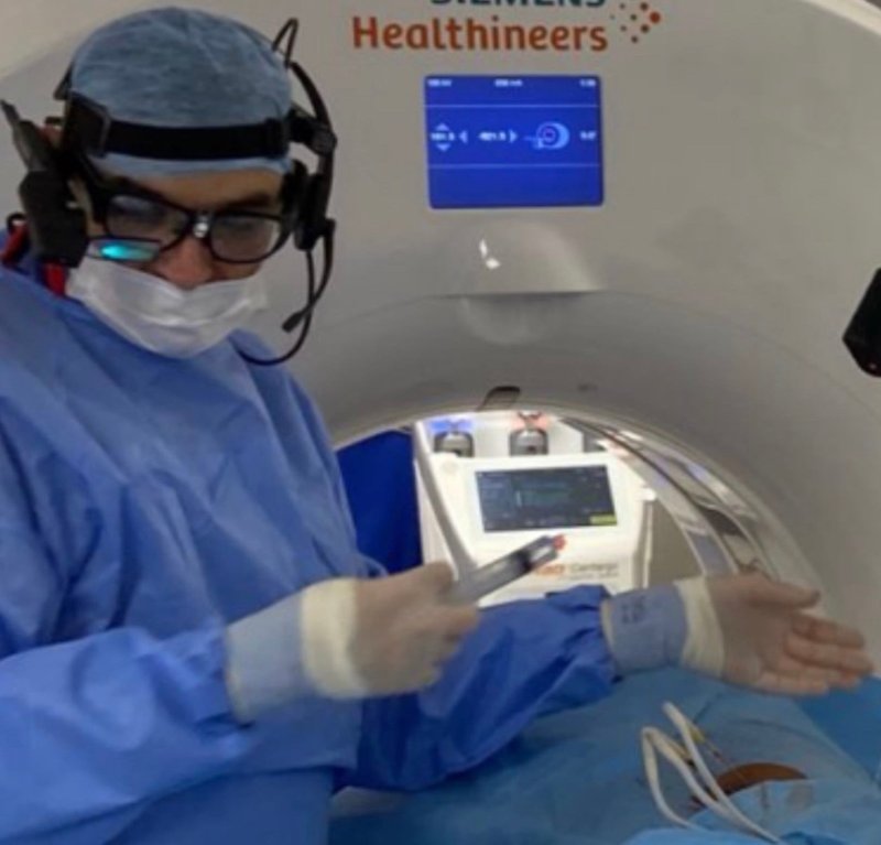 Professor Diamantopoulos working in an interventional radiology theatre